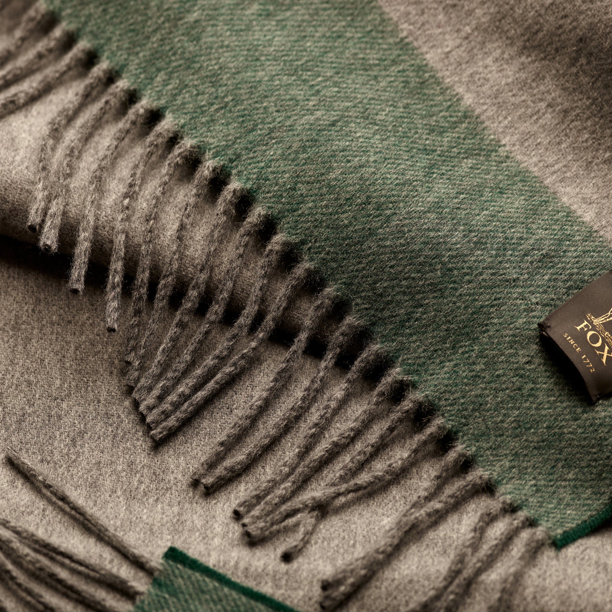 Fringe detail of Fox grey and green cashmere and wool brushed scarf