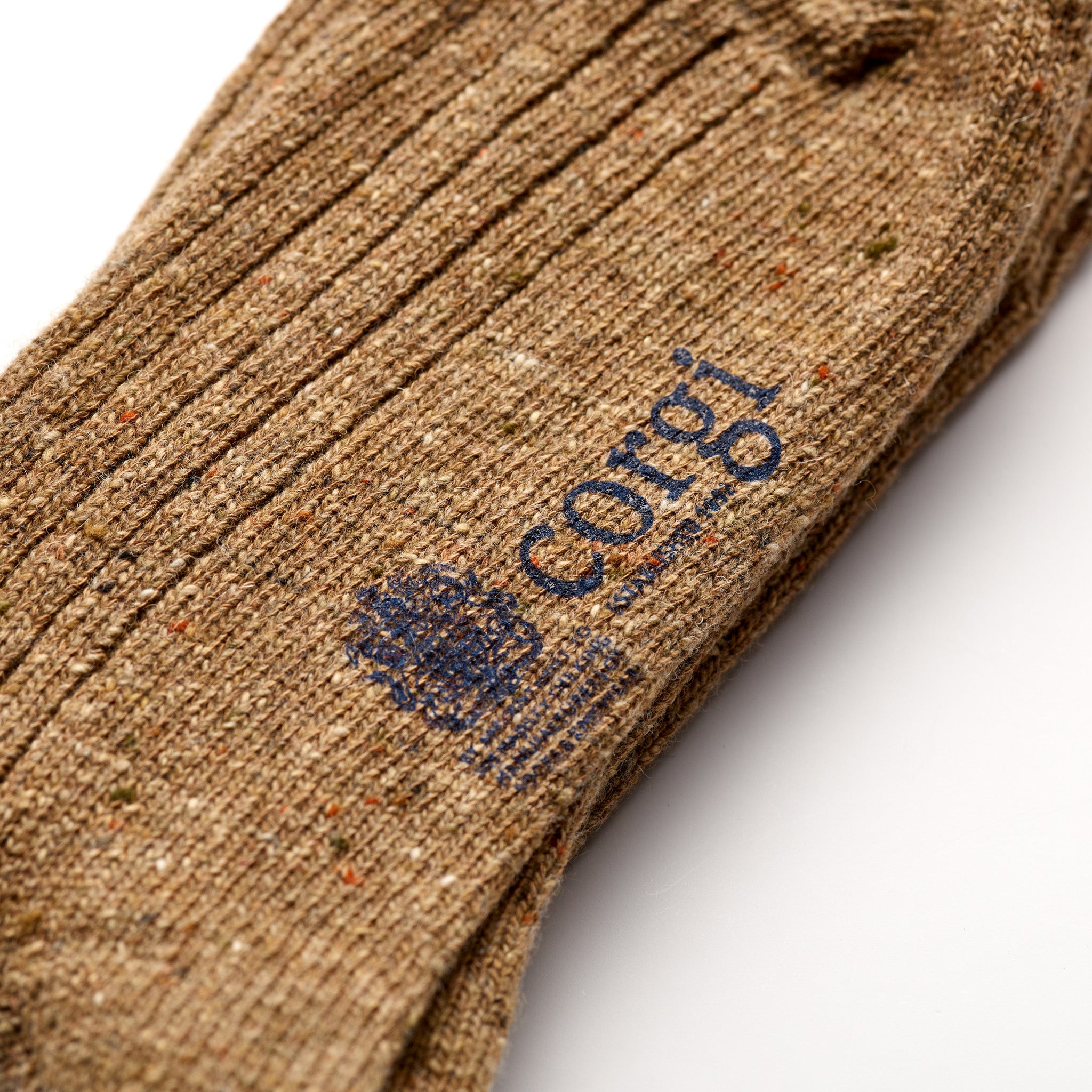 Corgi Heavyweight Plain Donegal Socks in Caramel foot logo and knit texture close-up