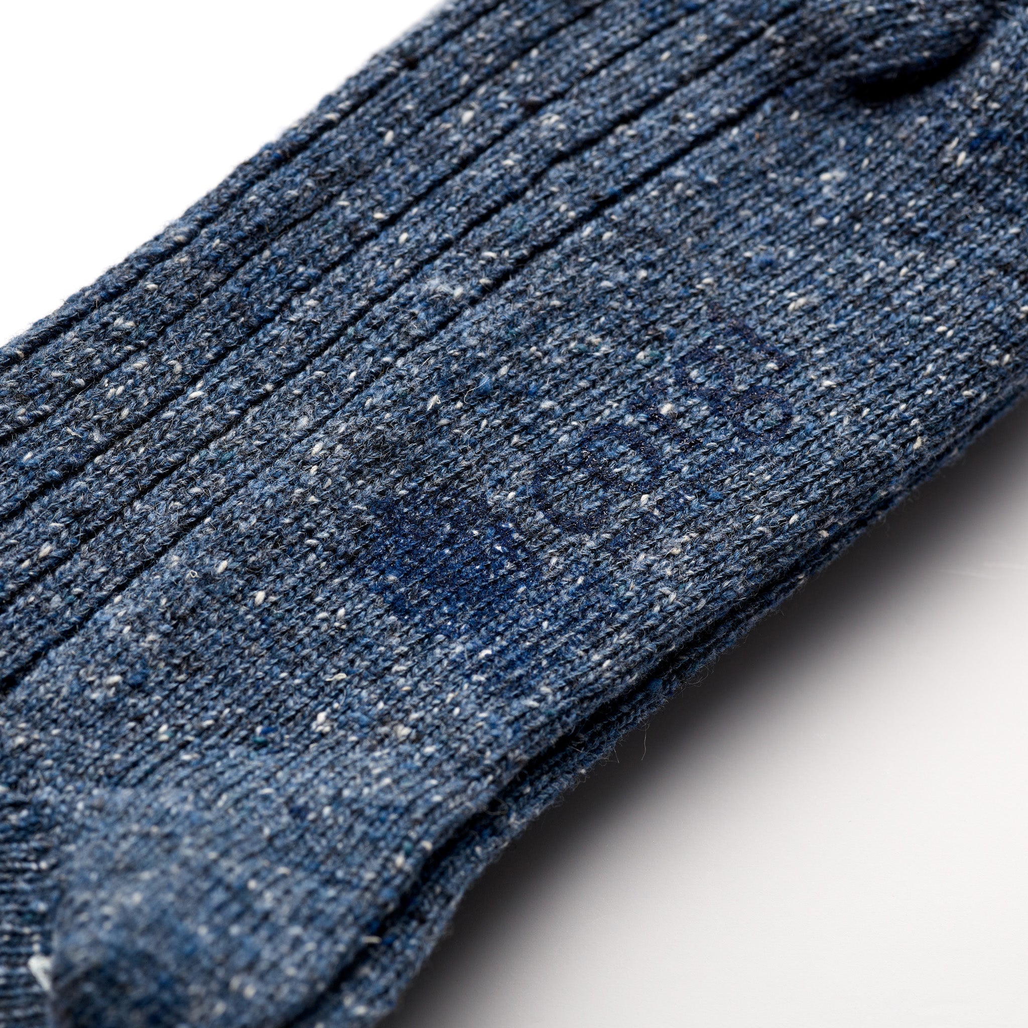 Corgi Heavyweight Plain Donegal Socks in Denim foot logo and knit texture close-up