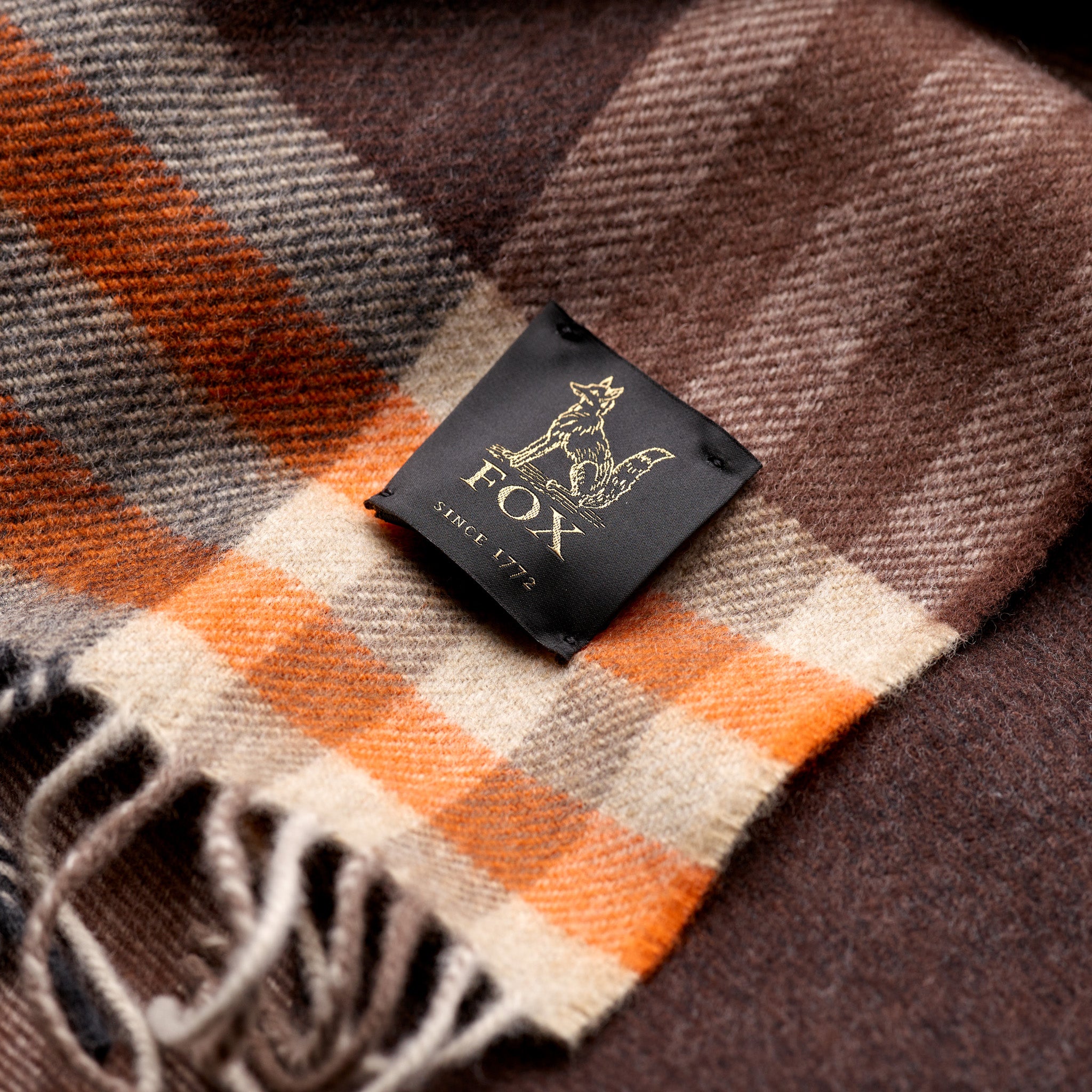 Fox woven label on brown and orange cashmere and wool check scarf