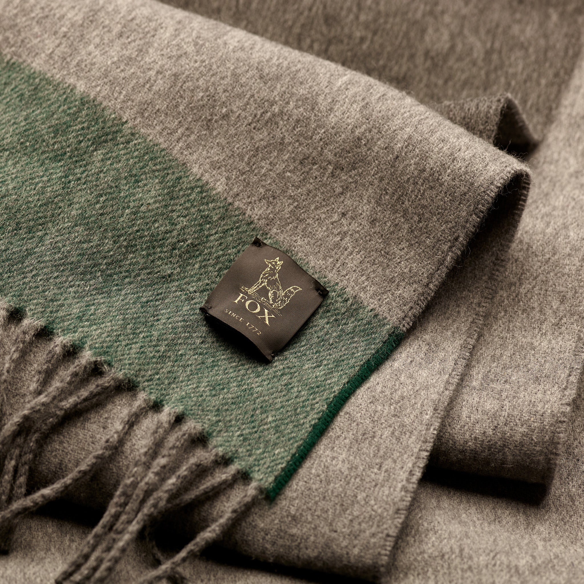 Fox woven label on grey and green cashmere and wool brushed scarf