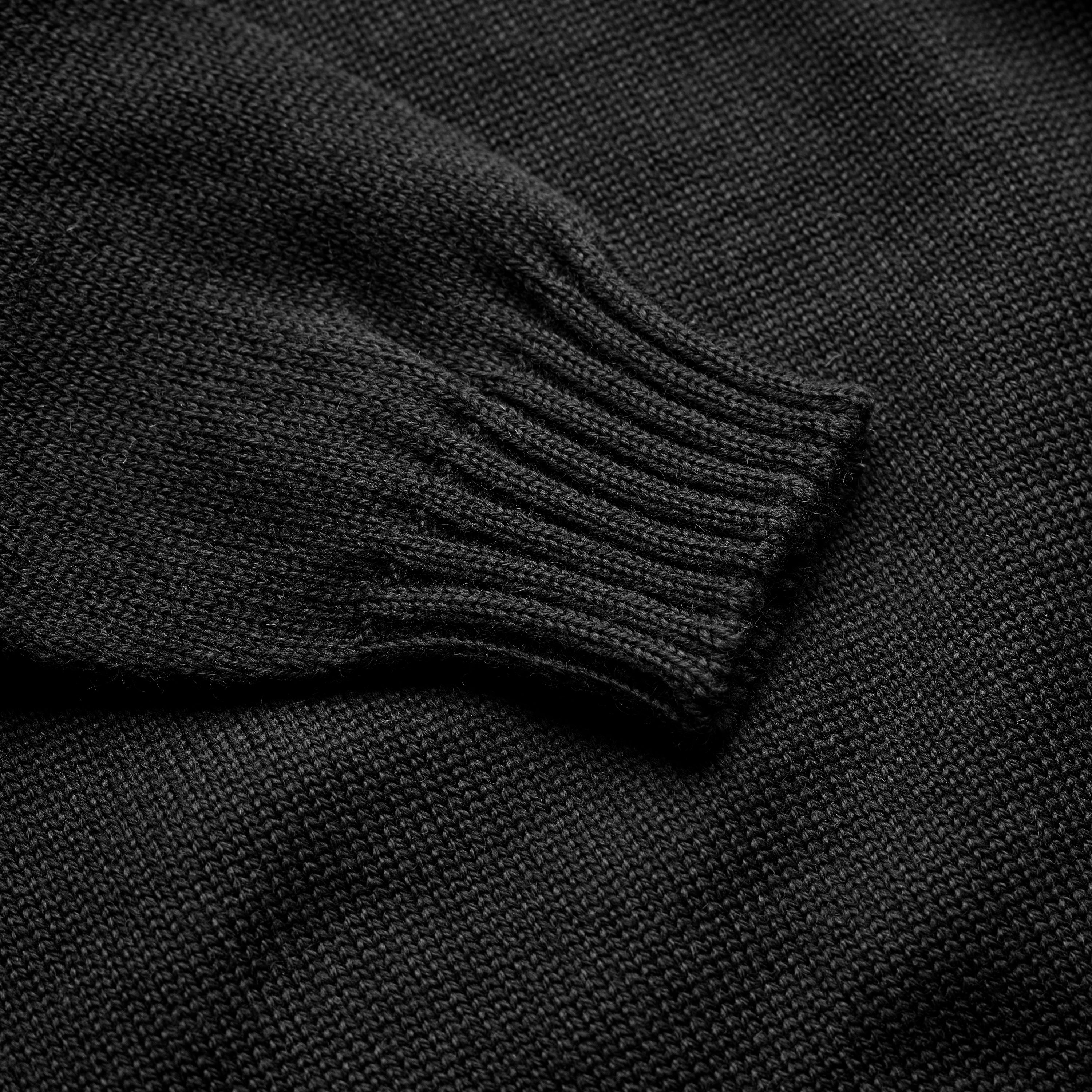 Ribbed cuff detail on the Guernsey Woollens x Fox roll neck knit in Midnight Black