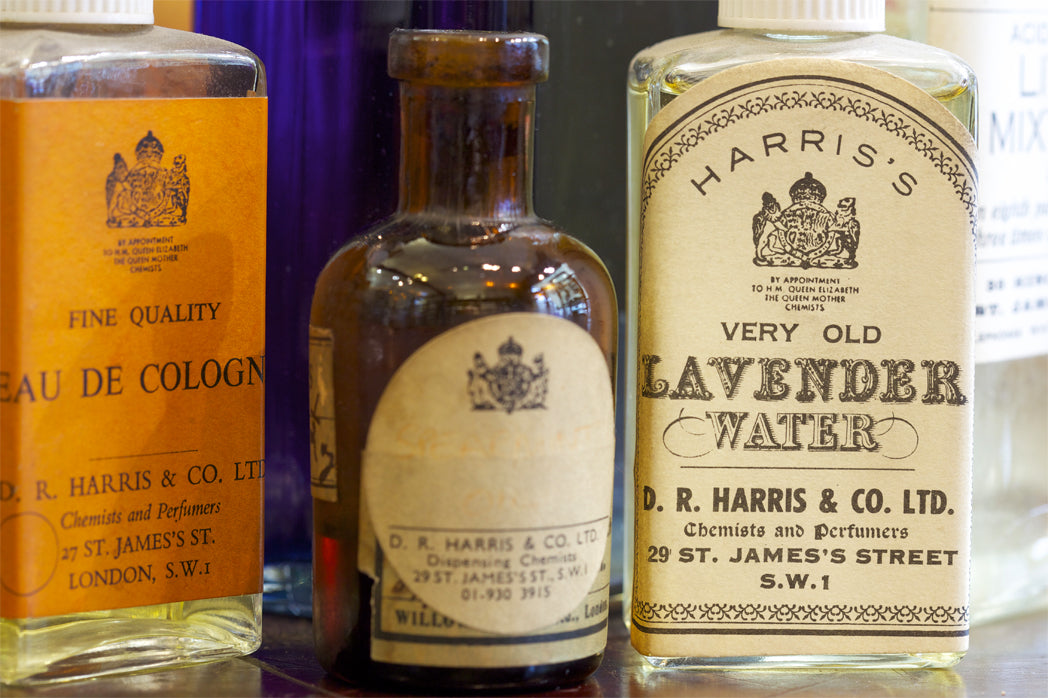 Lifestyle image of D.R. Harris & Co Ltd glass bottles, featuring eau de cologne and lavender water
